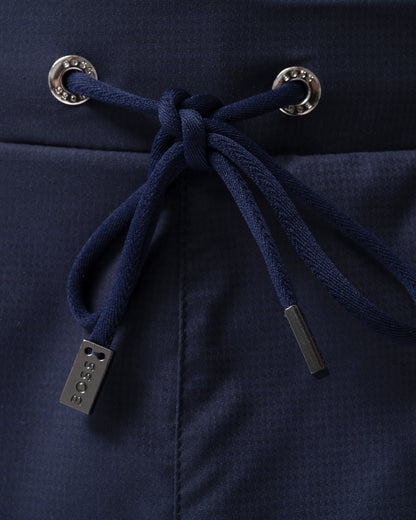 detail of BOSS Orange Isle Mens Ripstop-Fabric Swim Shorts with Contrast Logo in Navy 413