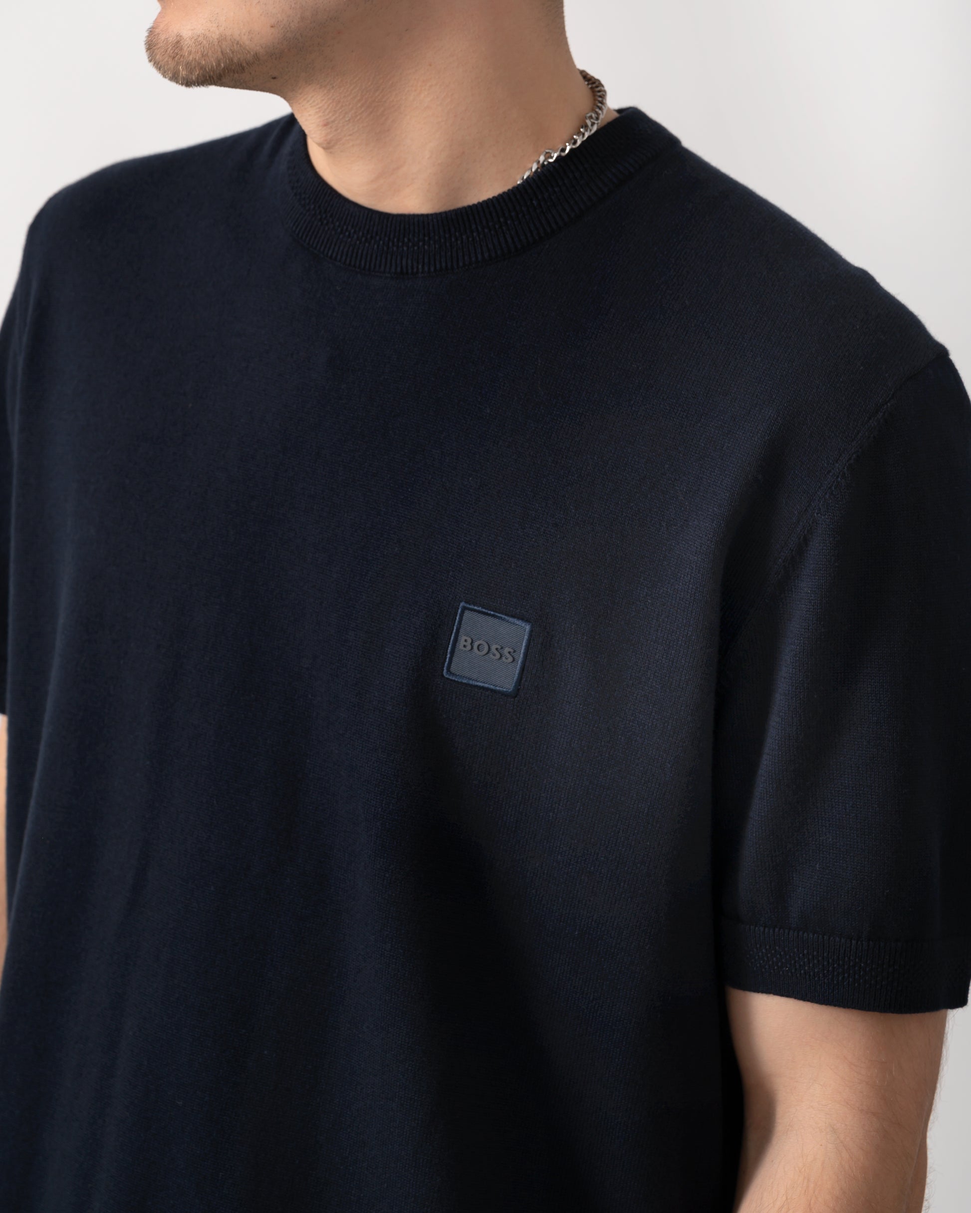 logo detail shot of a BOSS Orange Kanacho Mens T-Shirt in Dark Blue 404