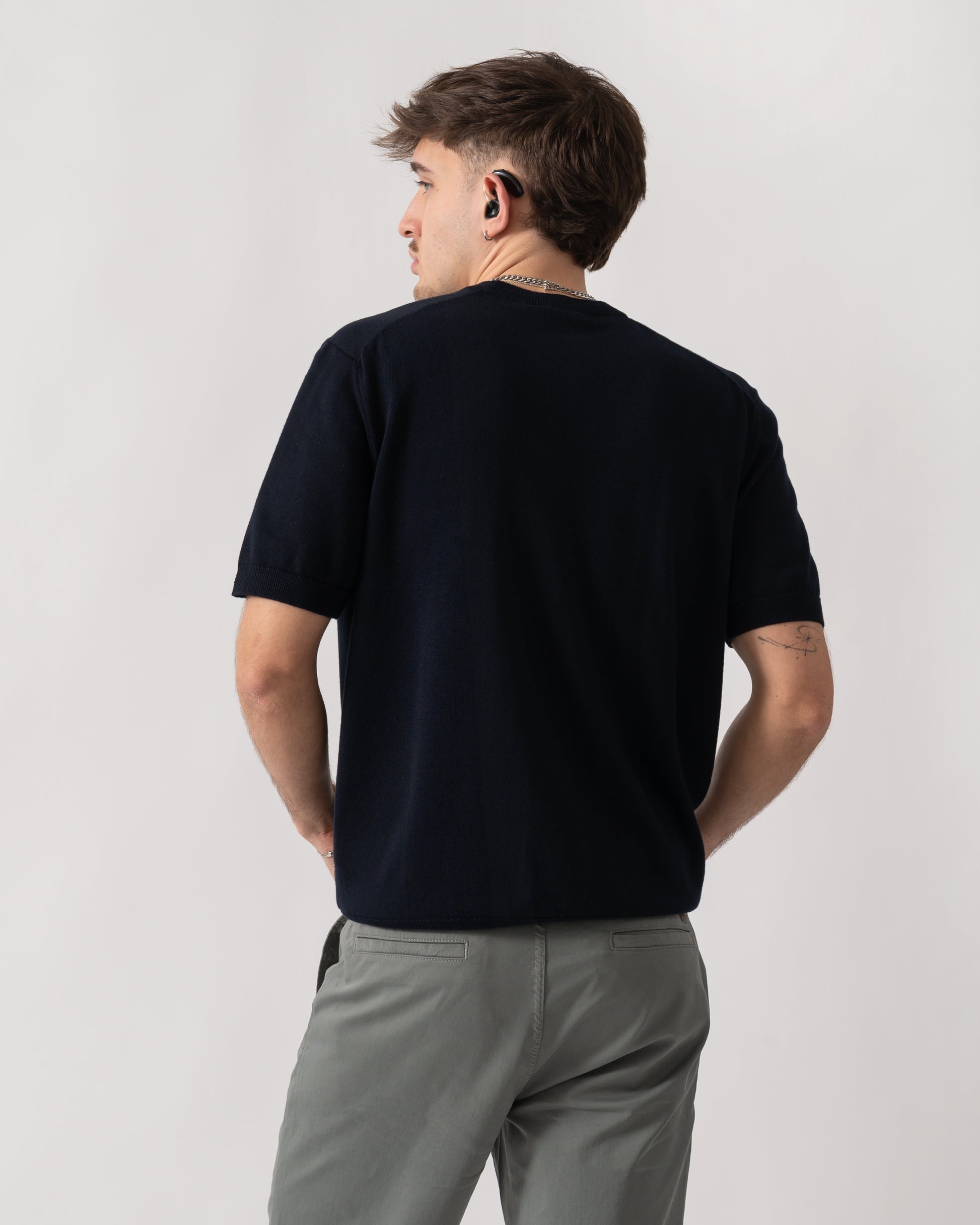 back shot of a model wearing a BOSS Orange Kanacho Mens T-Shirt in Dark Blue 404