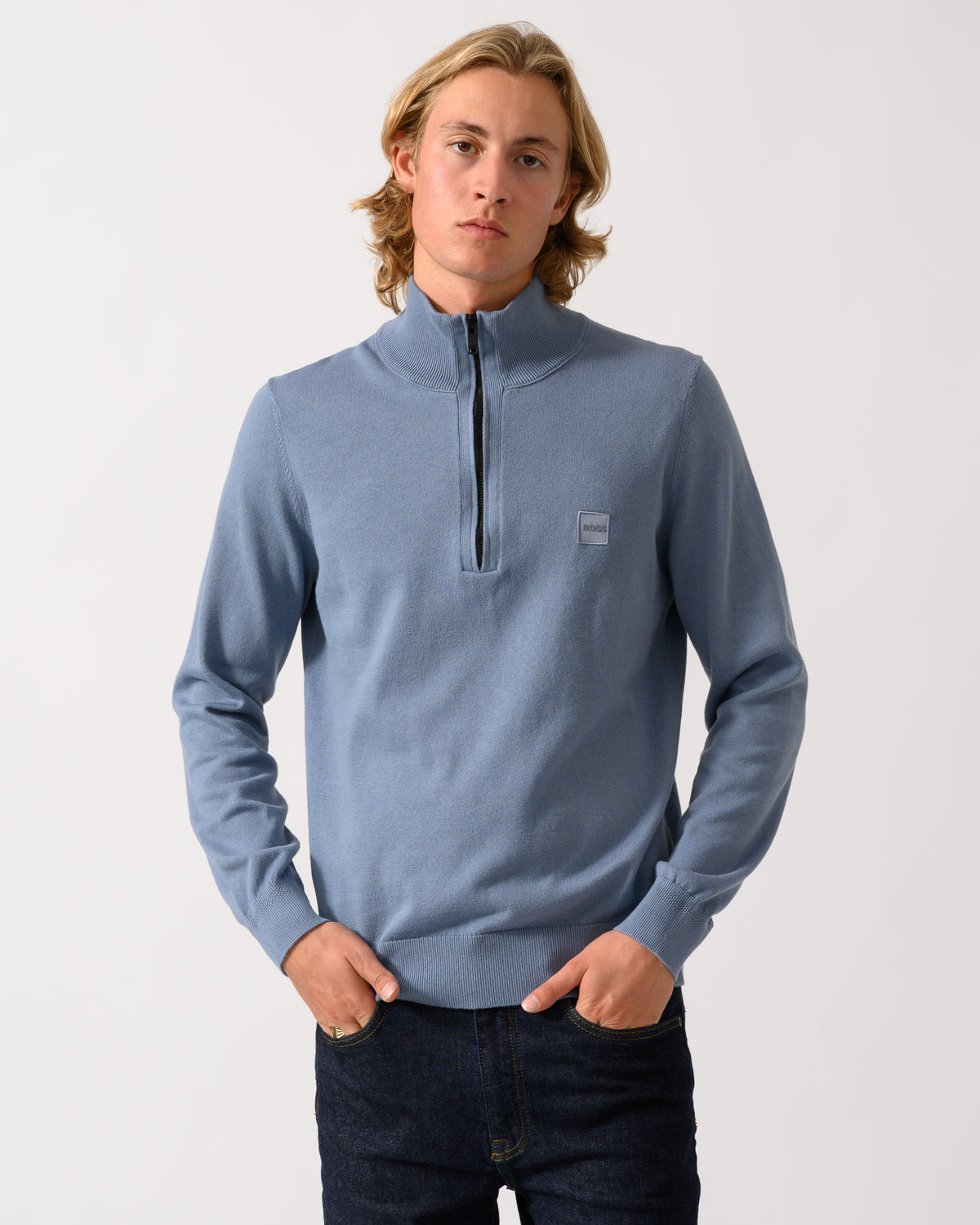 model wearing a BOSS Orange Kanobix S Mens 1/4 Zip Jumper in Medium Blue 424