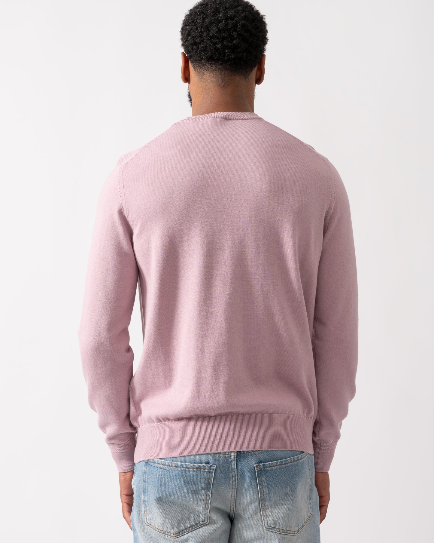 back of a model wearing a BOSS Orange Kanovano Mens Crew Neck Jumper in Light Pastel Purple