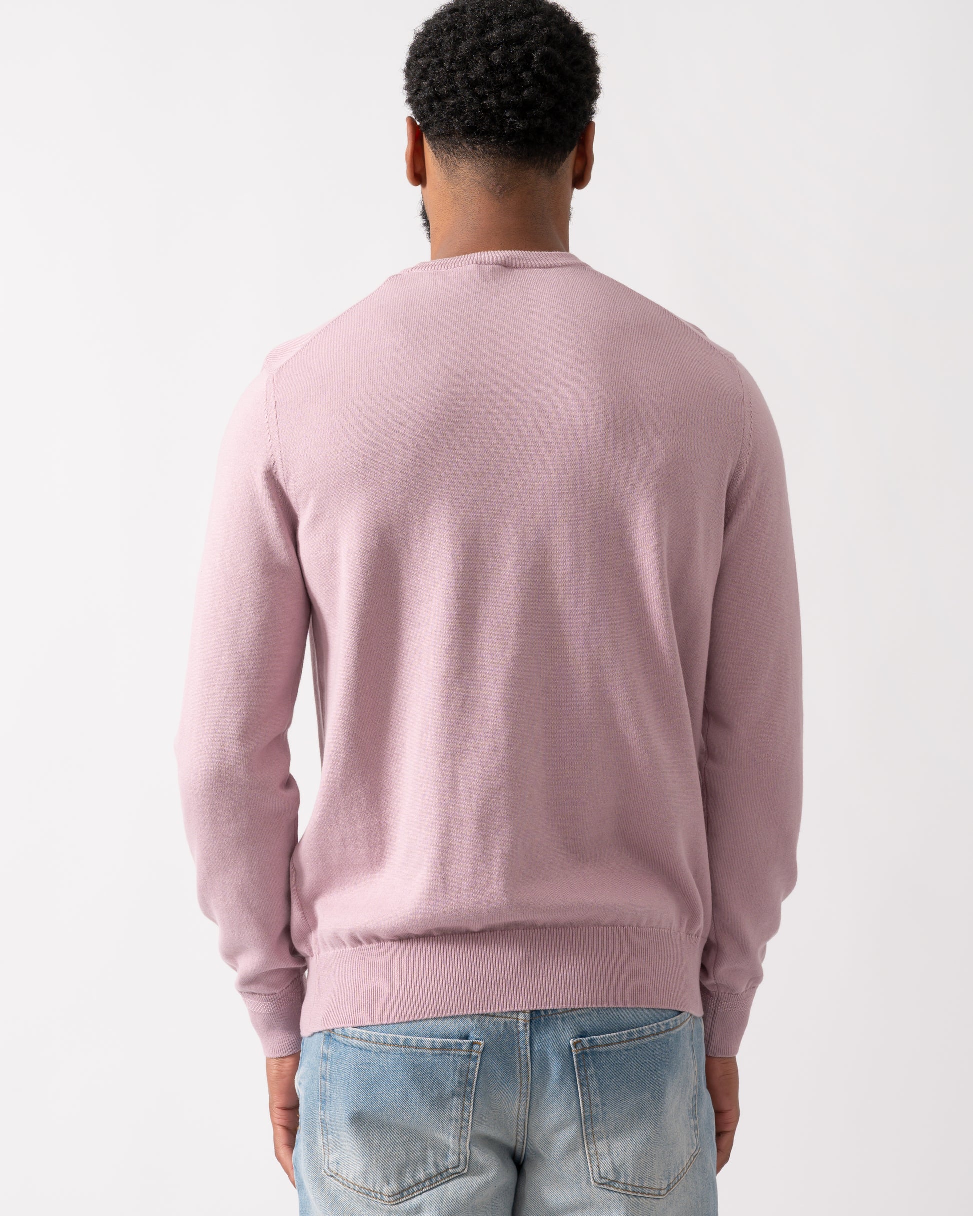 back of a model wearing a BOSS Orange Kanovano Mens Crew Neck Jumper in Light Pastel Purple