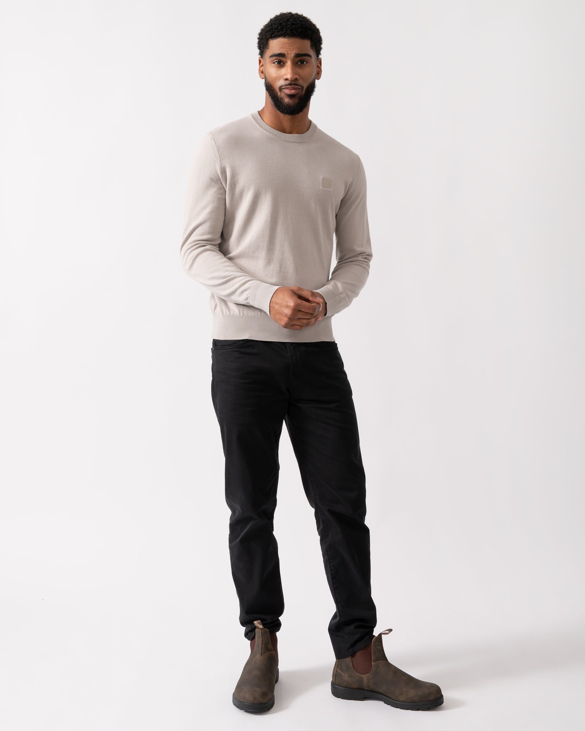 full legnth shot of a model wearing a BOSS Orange Kanovano Mens Crew Neck Jumper in Open Grey