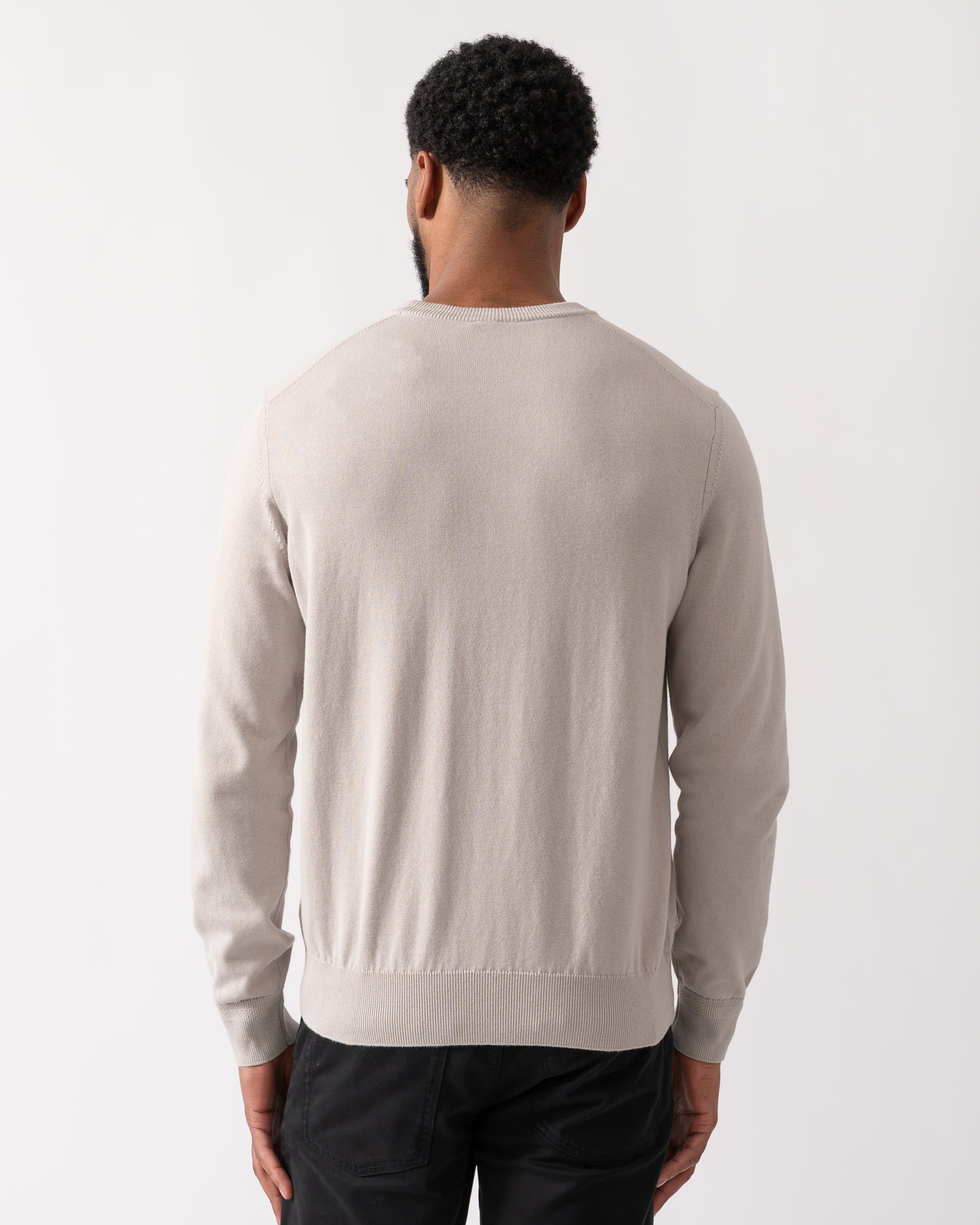 back shot of a model wearing a BOSS Orange Kanovano Mens Crew Neck Jumper in Open Grey