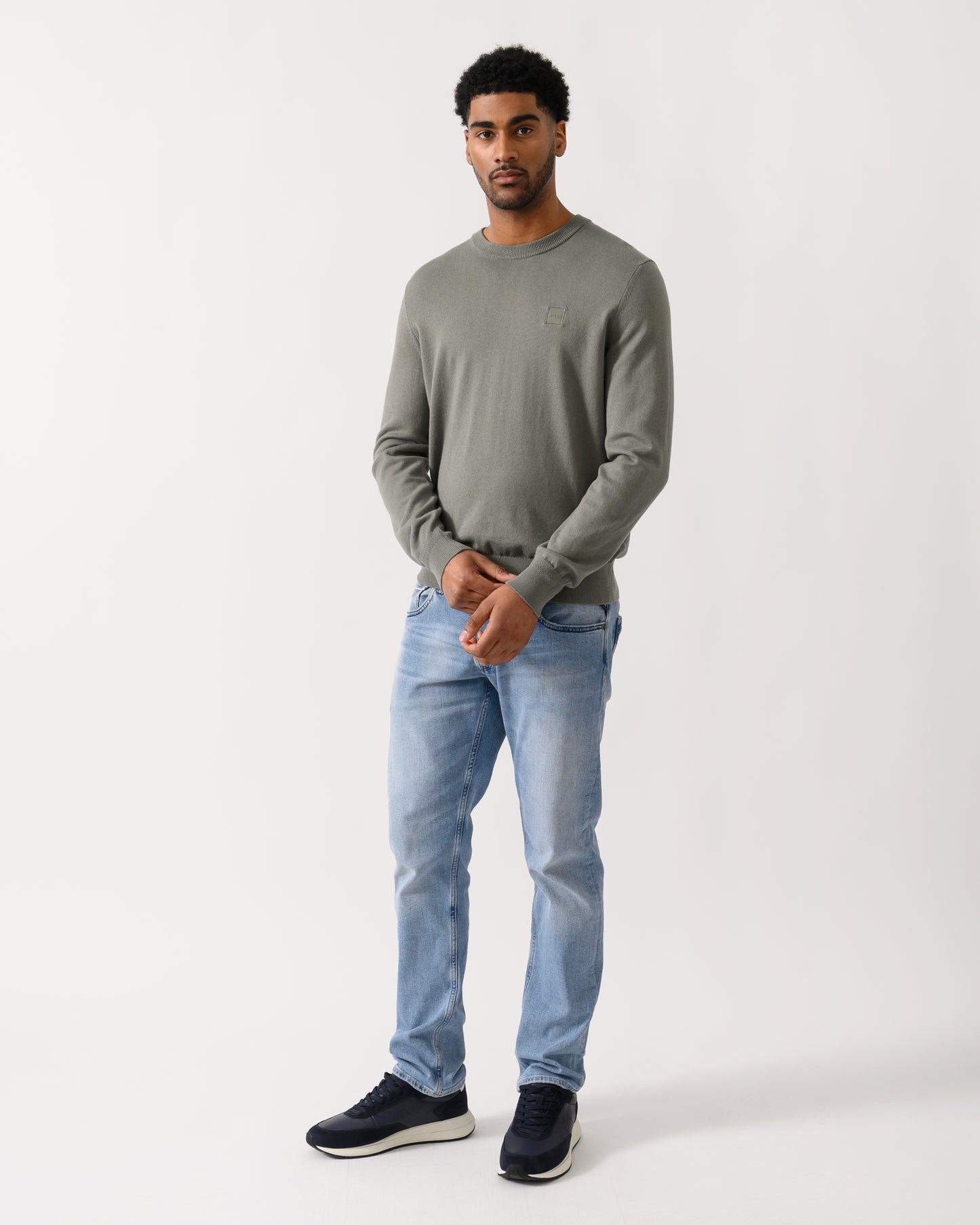 full length shot of a model wearing a BOSS Orange Kanovano Mens Crew Neck Jumper in Open Grey 076