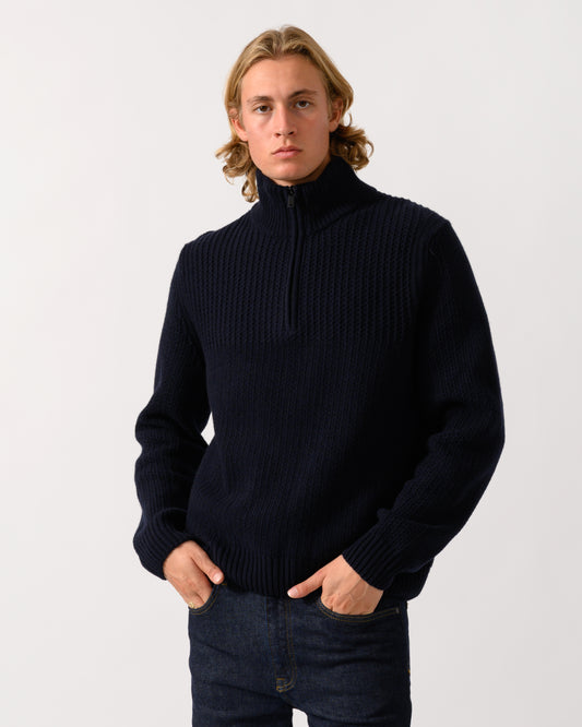 model wearing a BOSS Orange Kenter Mens 1/4 Zip Funnel Neck Jumper in Dark Blue 404