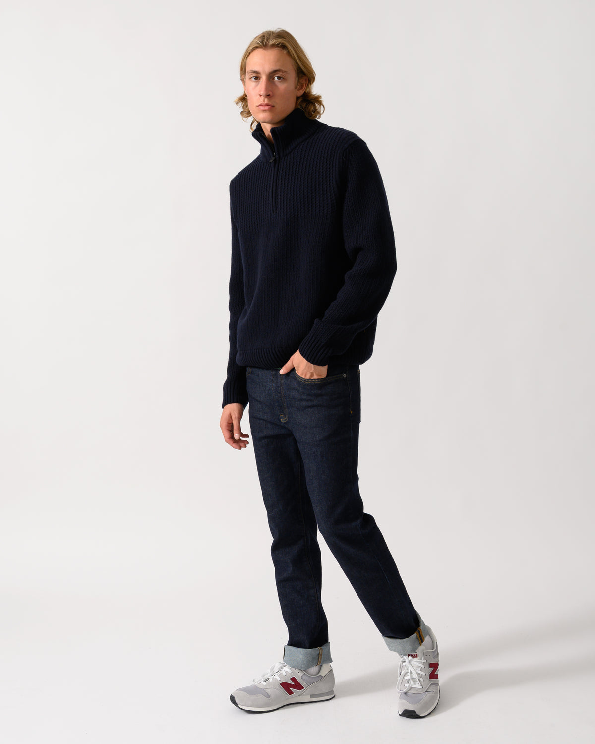 full length of a model wearing a BOSS Orange Kenter Mens 1/4 Zip Funnel Neck Jumper in Dark Blue 404