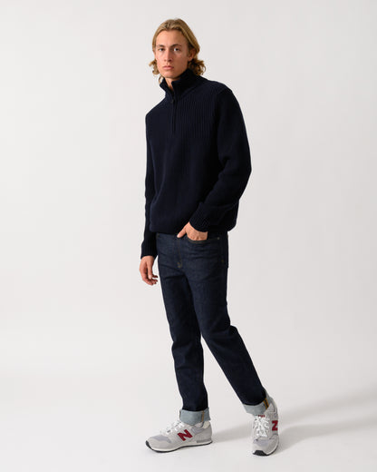 full length of a model wearing a BOSS Orange Kenter Mens 1/4 Zip Funnel Neck Jumper in Dark Blue 404