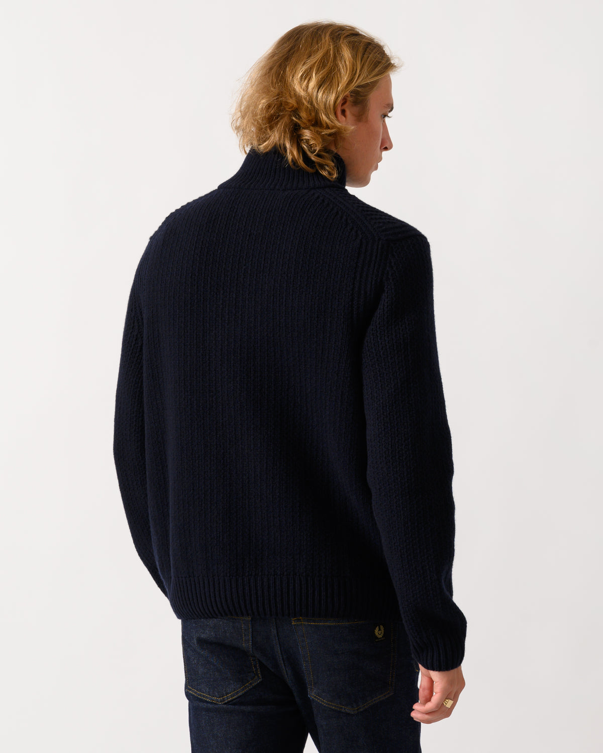 back of a model wearing a BOSS Orange Kenter Mens 1/4 Zip Funnel Neck Jumper in Dark Blue 404