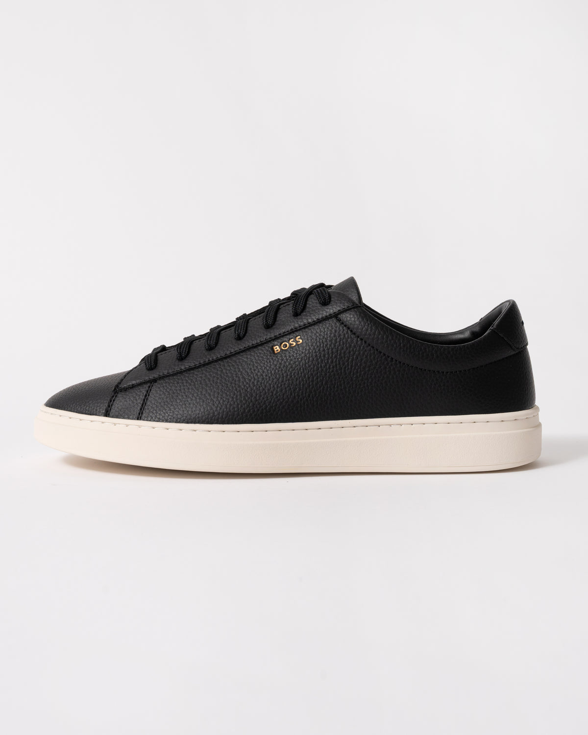 side studio shot of BOSS Orange Kieran Mens Grained-leather trainers with white rubber sole in Black 008