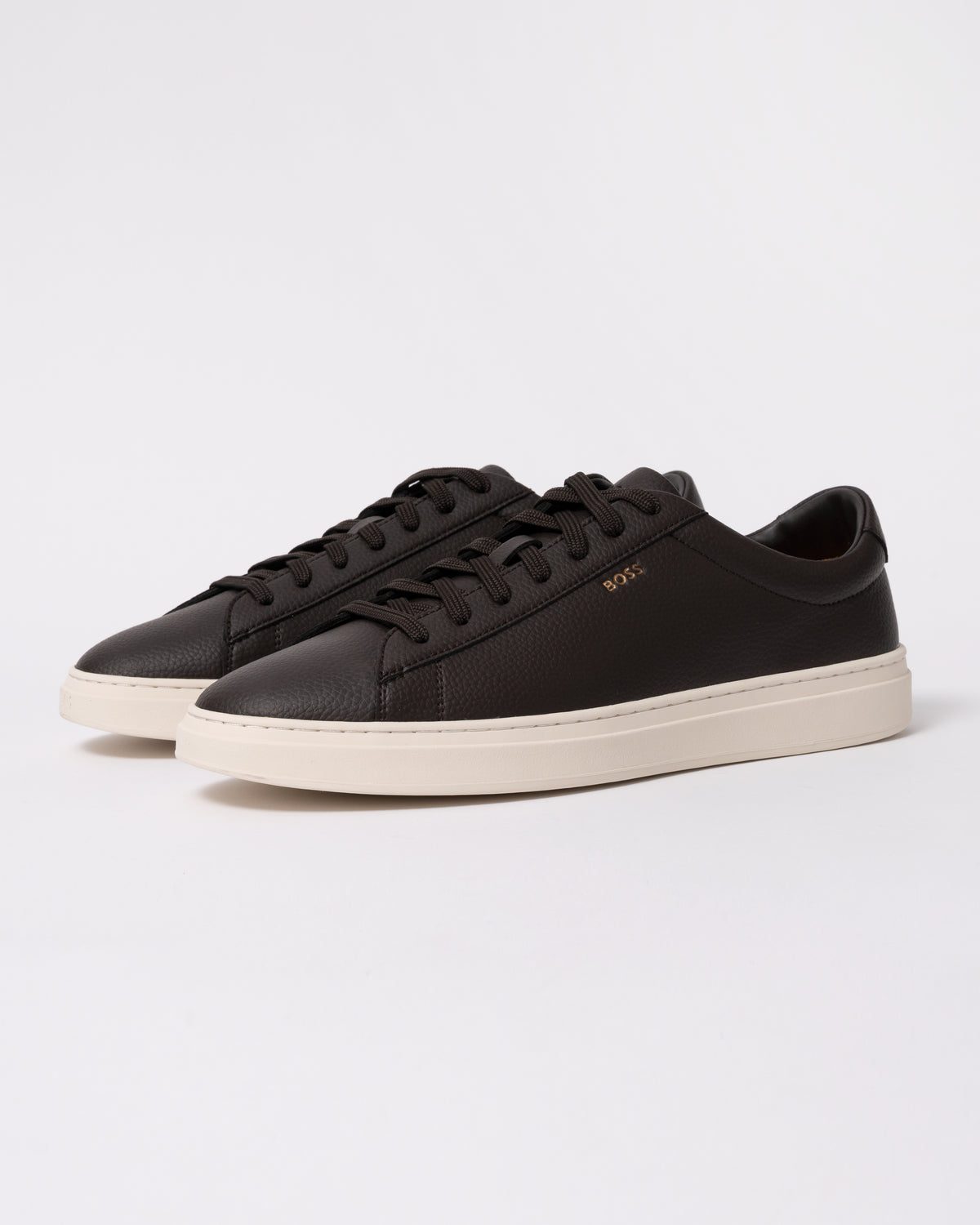 Studio photograph showing BOSS Orange Kieran Mens Grained-leather trainers with rubber sole in Dark Brown 203