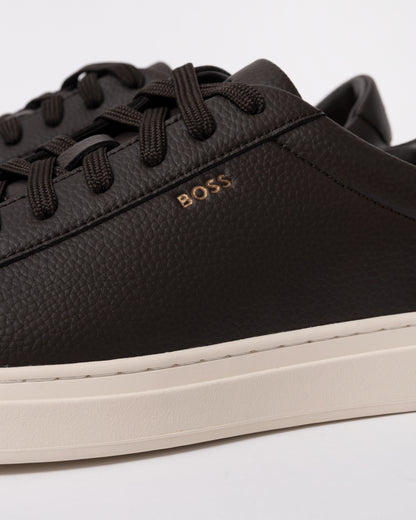 Studio photograph showing close up of BOSS Orange Kieran Mens Grained-leather trainers with rubber sole in Dark Brown 203
