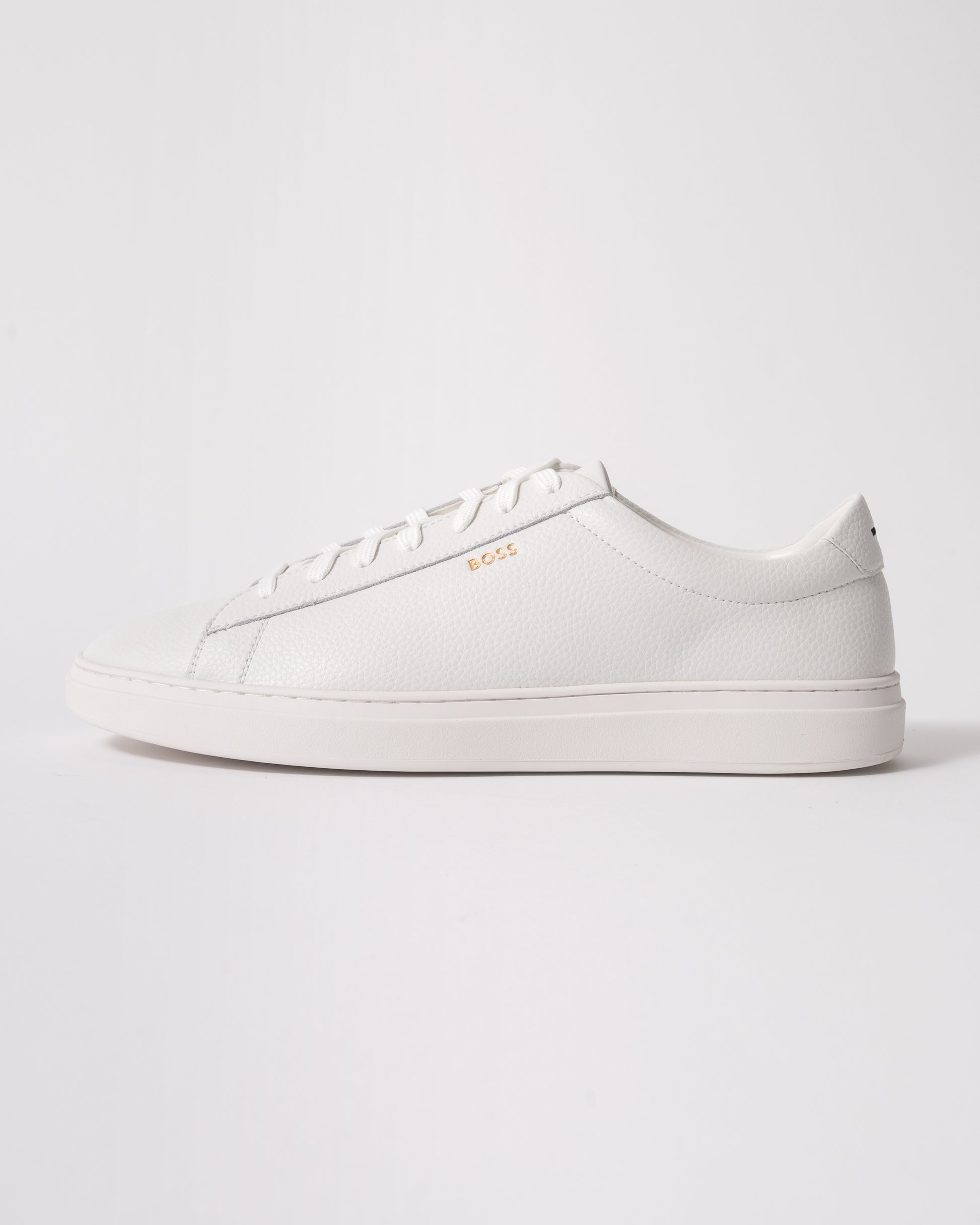 side studio shot of BOSS Orange Kieran Mens Grained-leather trainers with rubber sole in White 100