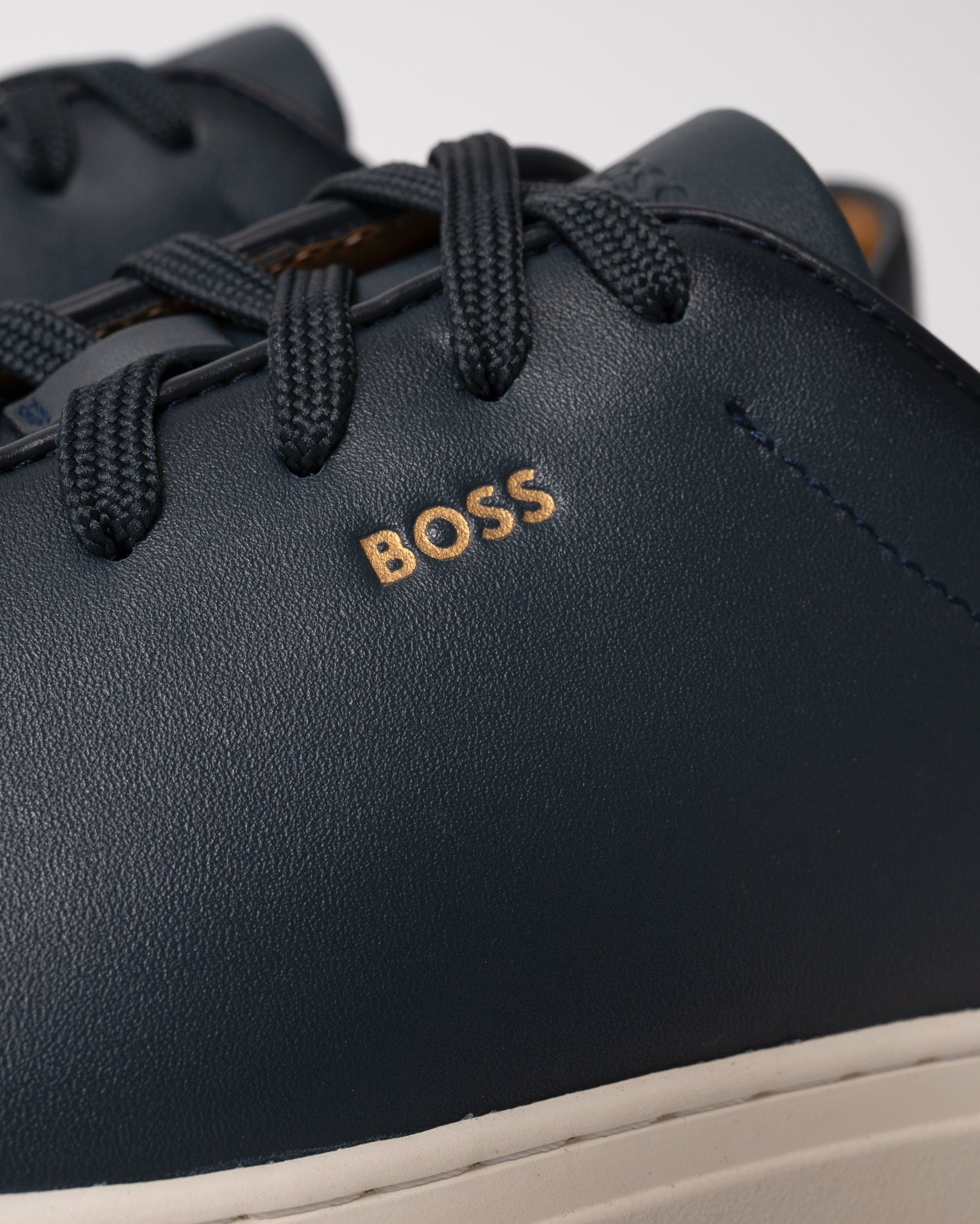 close up studio shot of BOSS Orange Kieran_Tenn_butb Mens Trainers in Dark Blue 401