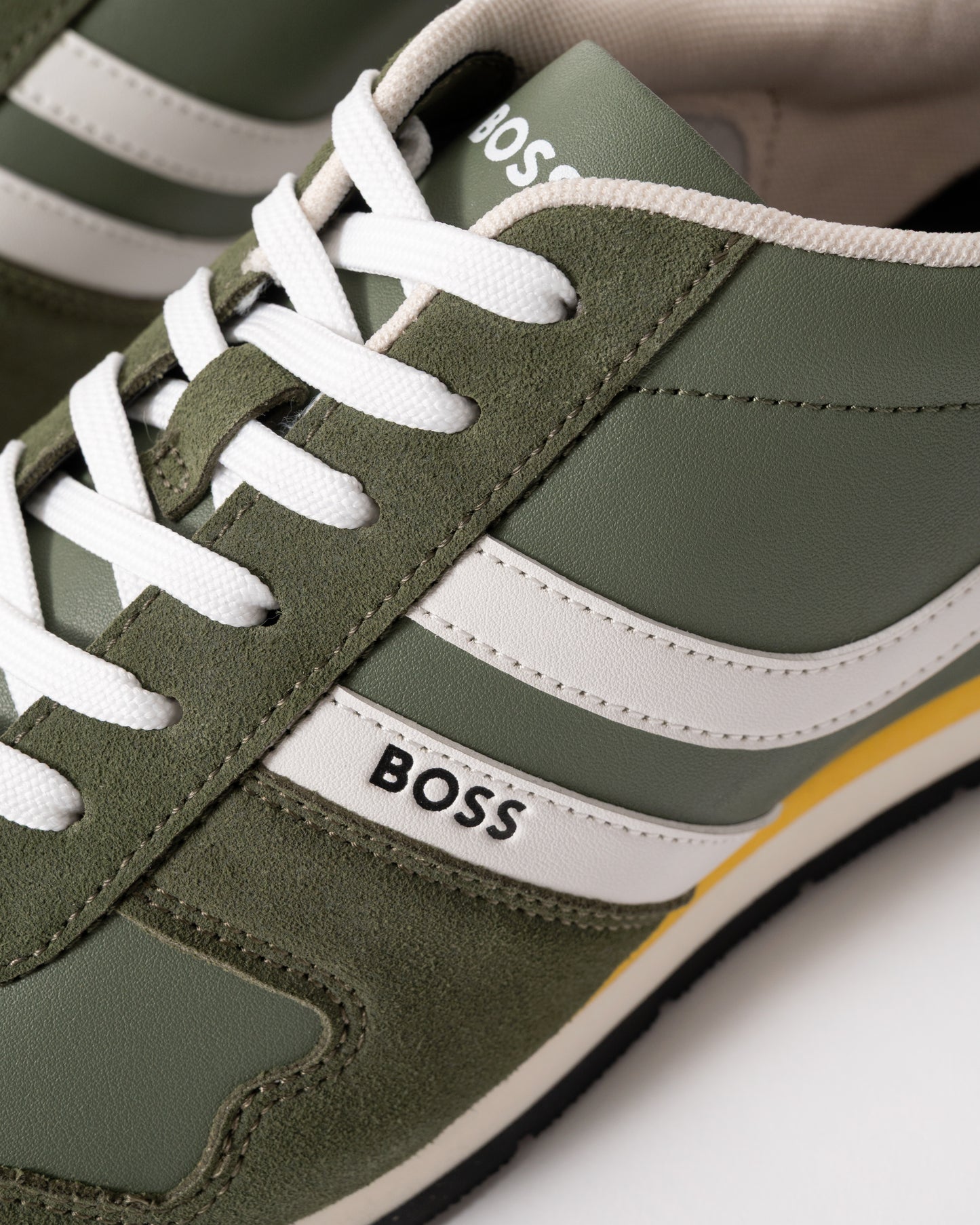 close up view of BOSS Orange Levon Runn pumi Mens Trainers in Dark Green 307