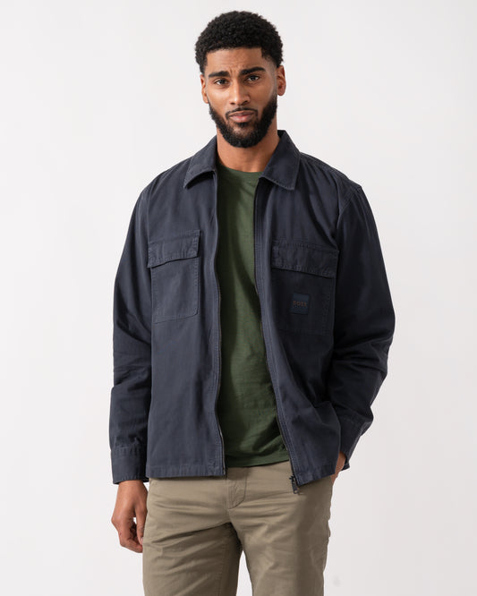 model wearing a BOSS Orange Lovel Mens Zip Overshirt in Dark Blue