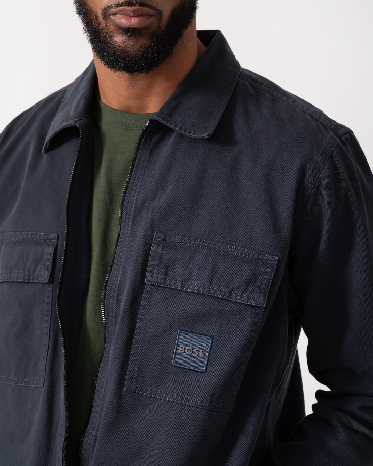 close up of a model wearing a BOSS Orange Lovel Mens Zip Overshirt in Dark Blue