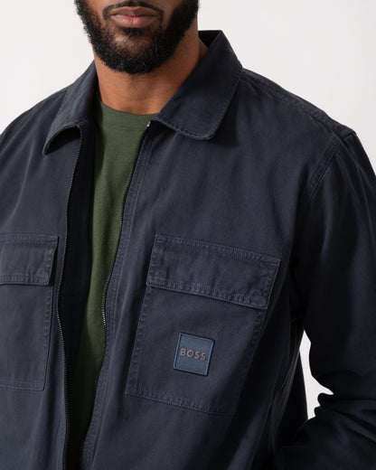 close up of a model wearing a BOSS Orange Lovel Mens Zip Overshirt in Dark Blue