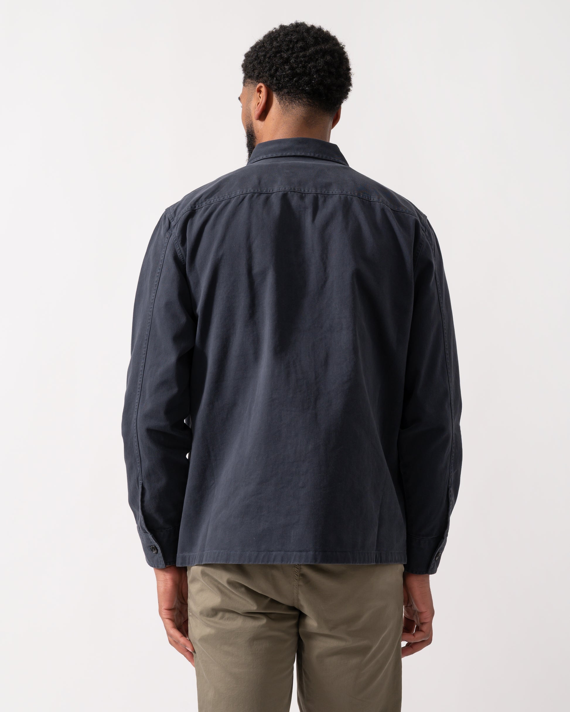 back shot of a model wearing a BOSS Orange Lovel Mens Zip Overshirt in Dark Blue