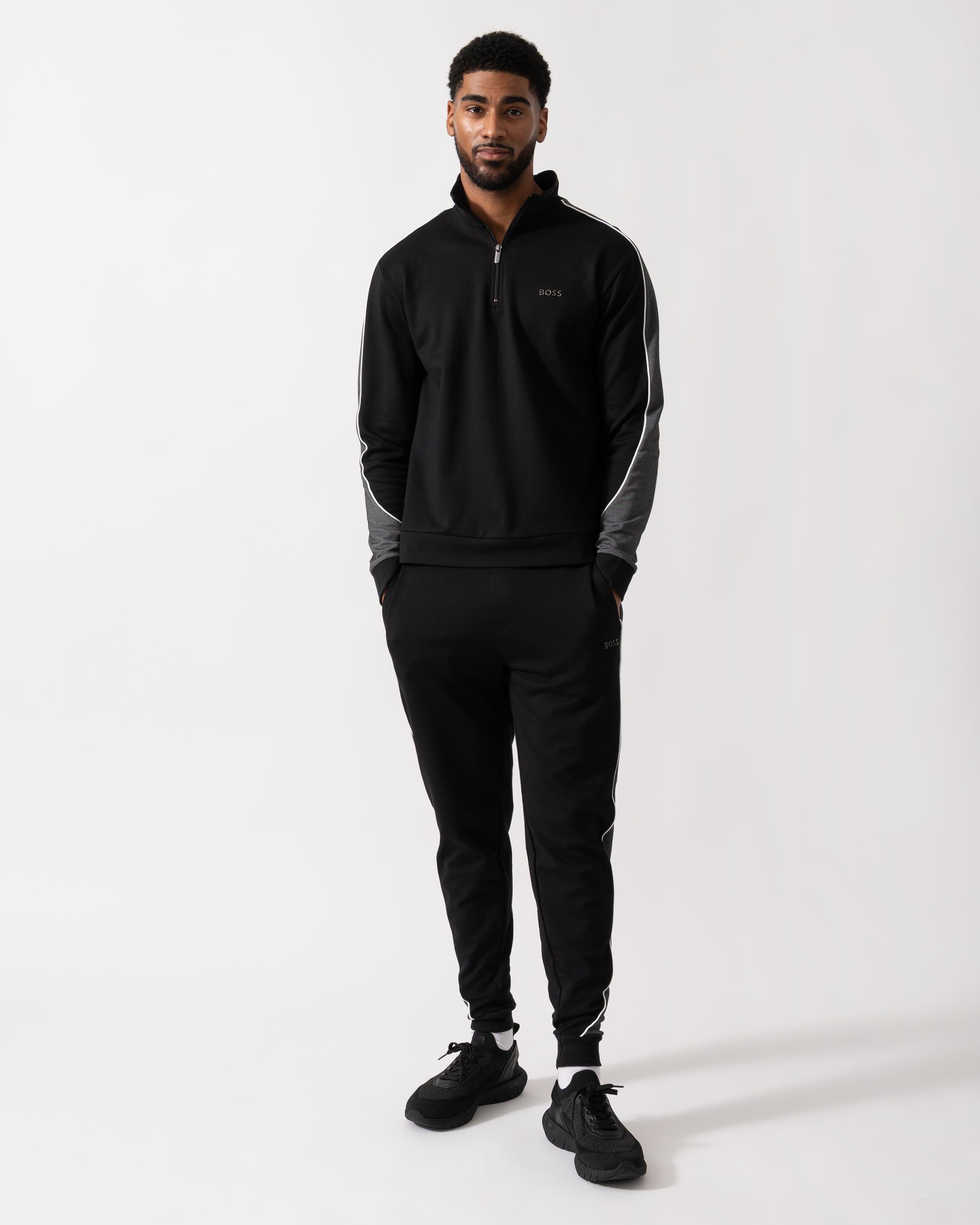 Full length shot of a Model wearing a BOSS Orange Mens 1/4 Zip Loungewear Tracksuit Jacket in Black
