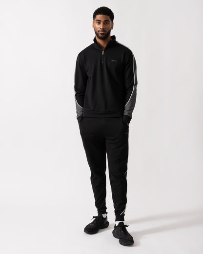 Full length shot of a Model wearing a BOSS Orange Mens 1/4 Zip Loungewear Tracksuit Jacket in Black