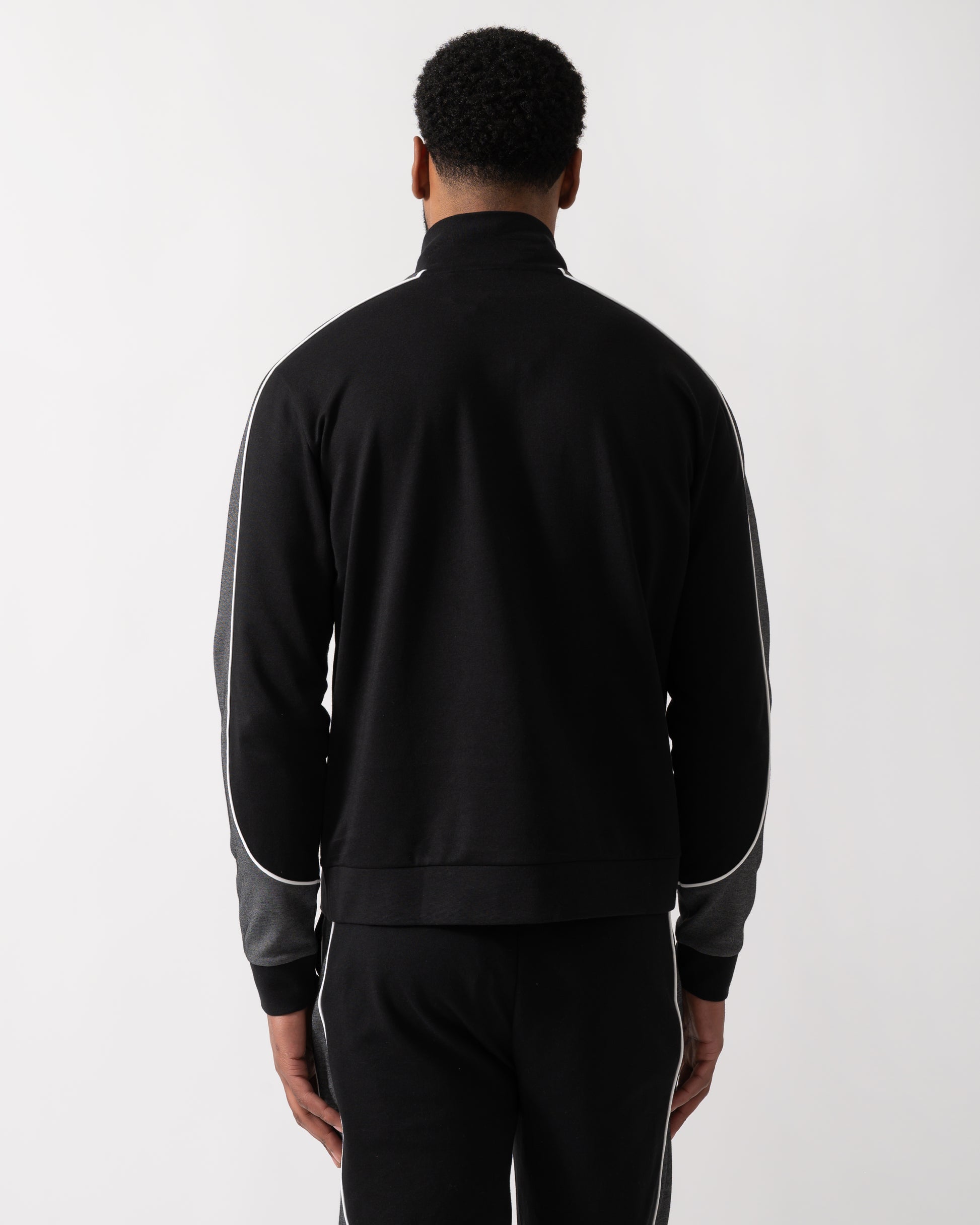 Back shot of a Model wearing a BOSS Orange Mens 1/4 Zip Loungewear Tracksuit Jacket in Black