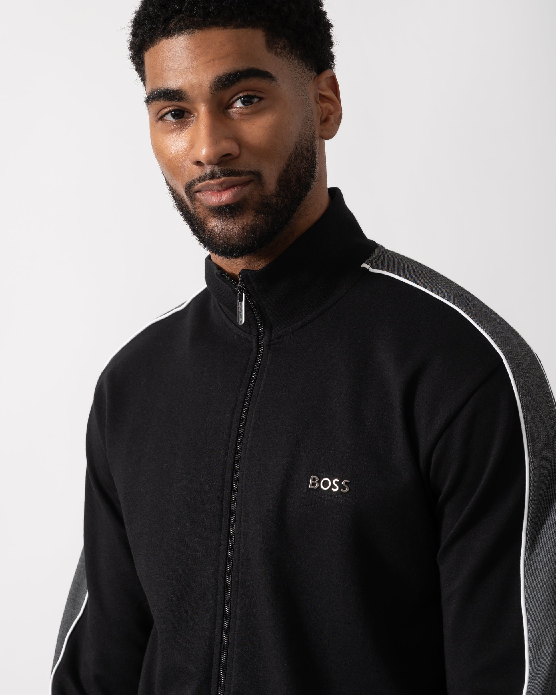 Close up shot of a Model wearing a BOSS Orange Mens Full Zip Loungewear Tracksuit Jacket in Black