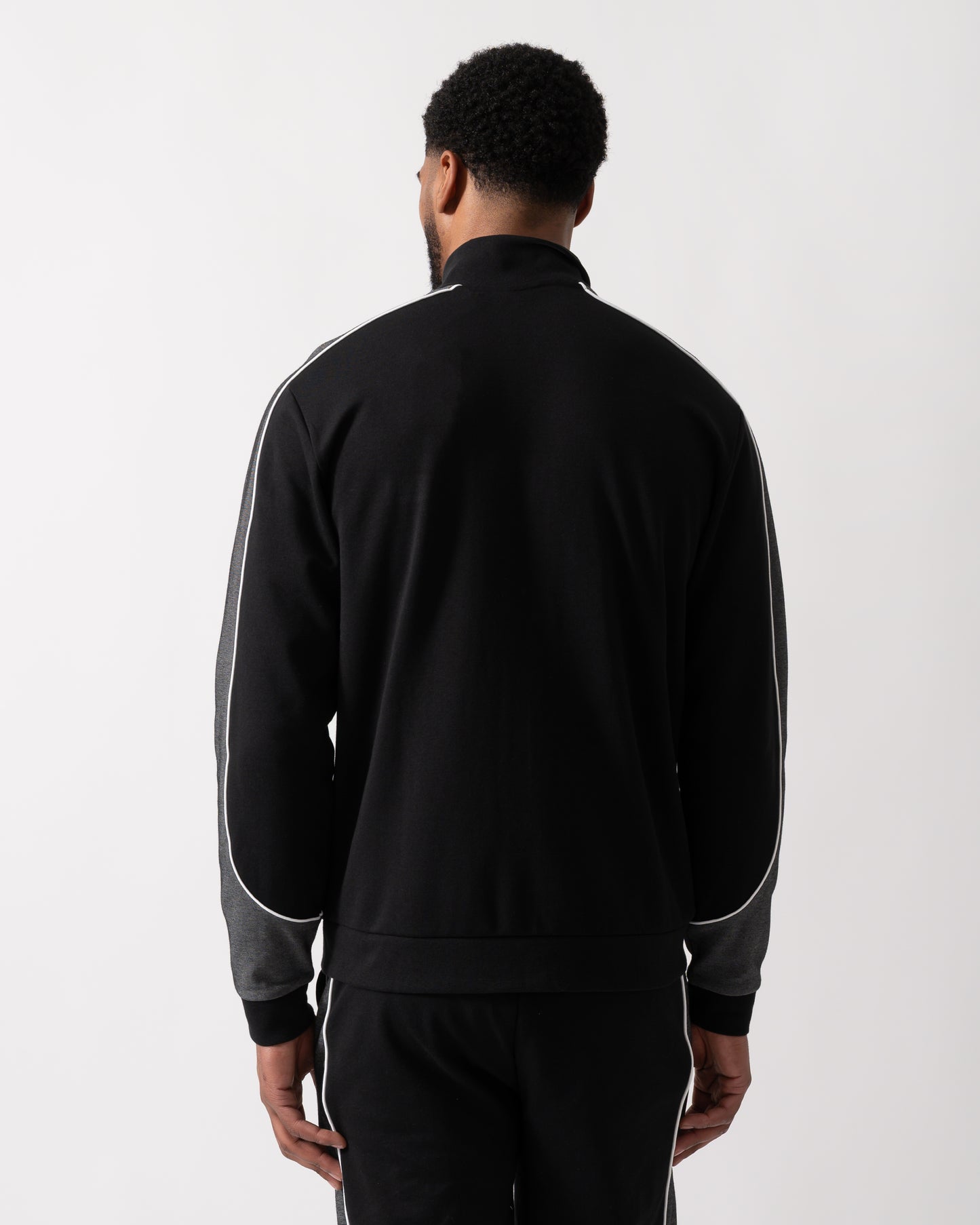 Back shot of a Model wearing a BOSS Orange Mens Full Zip Loungewear Tracksuit Jacket in Black