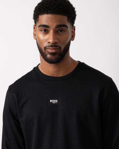 Close up shot of a Model wearing a BOSS Orange Mens Iconic Loungewear Sweatshirt in Black