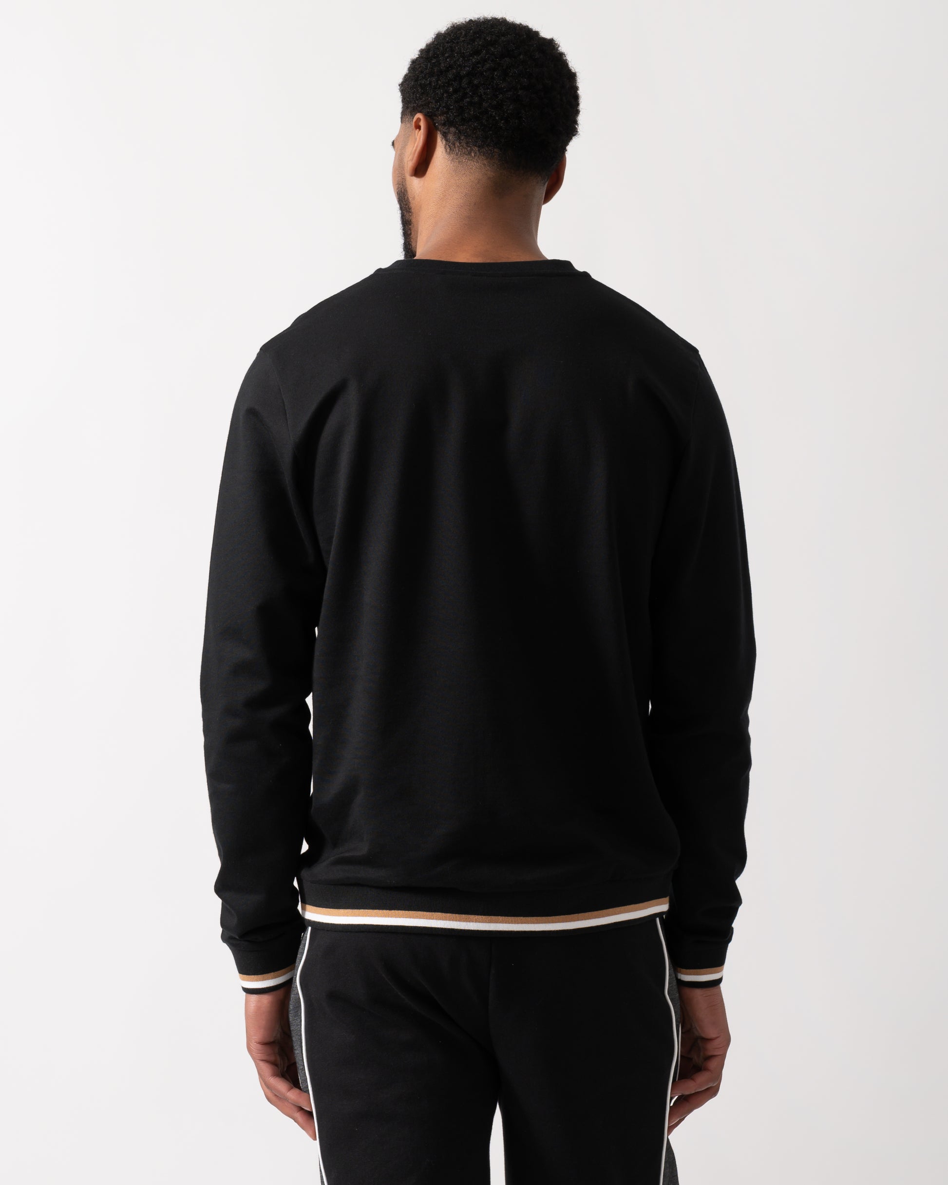 Back shot of a Model wearing a BOSS Orange Mens Iconic Loungewear Sweatshirt in Black