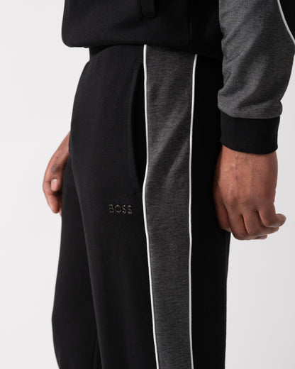 close up shot of a Model wearing a BOSS Orange Mens Loungewear Tracksuit Pants in Black
