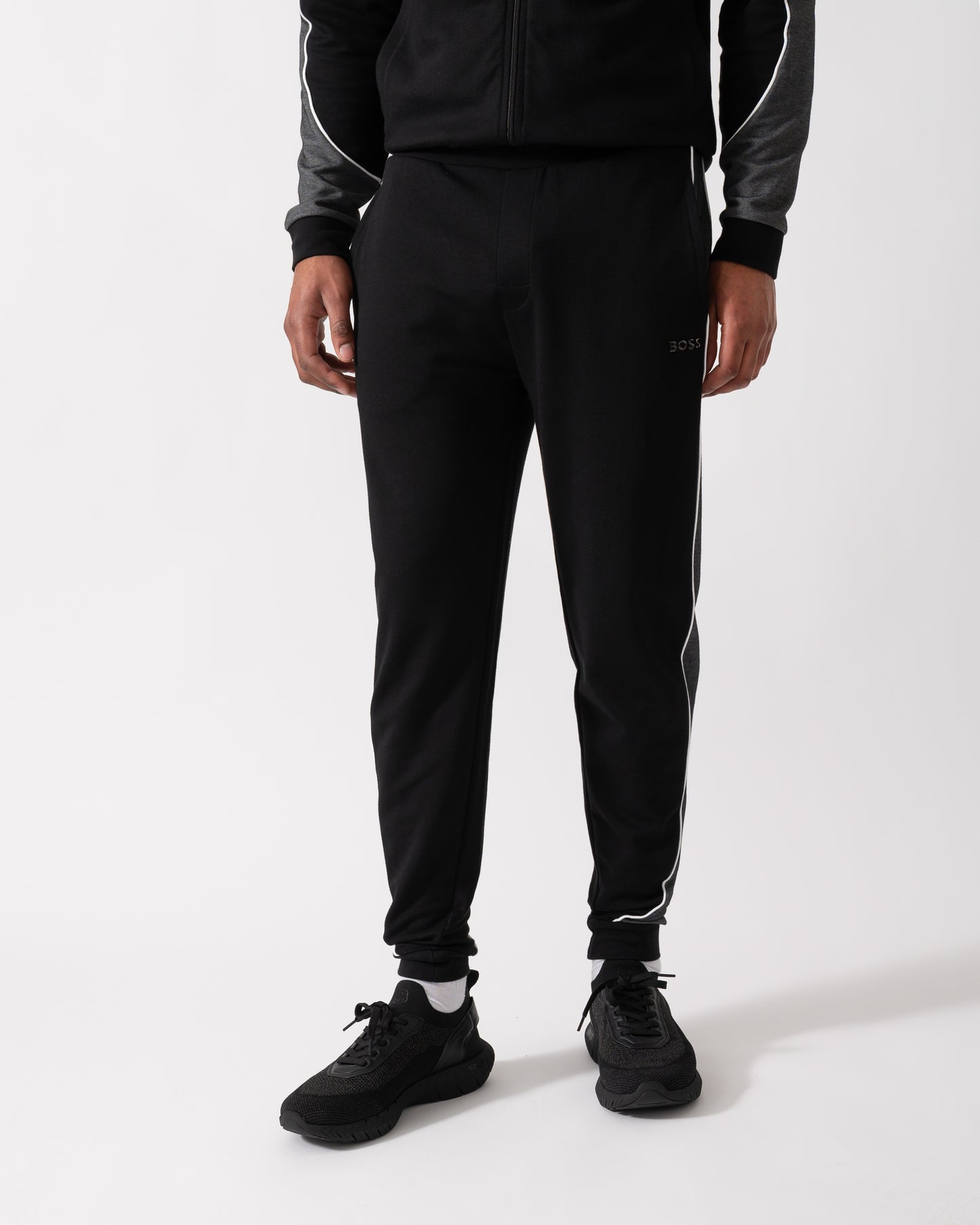 Close up shot of a Model wearing a BOSS Orange Mens Loungewear Tracksuit Pants in Black