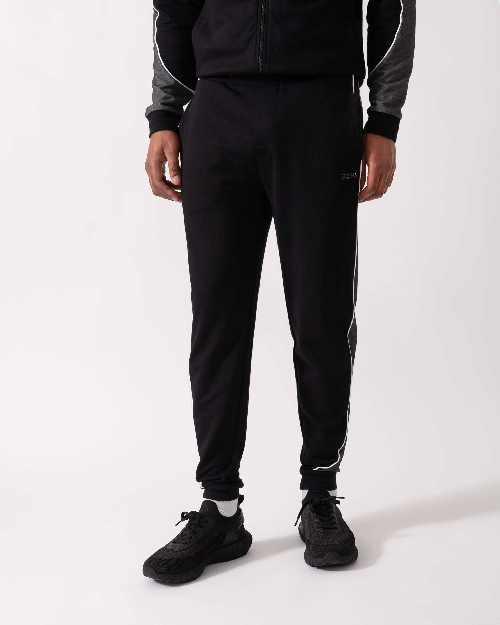 Close up shot of a Model wearing a BOSS Orange Mens Loungewear Tracksuit Pants in Black