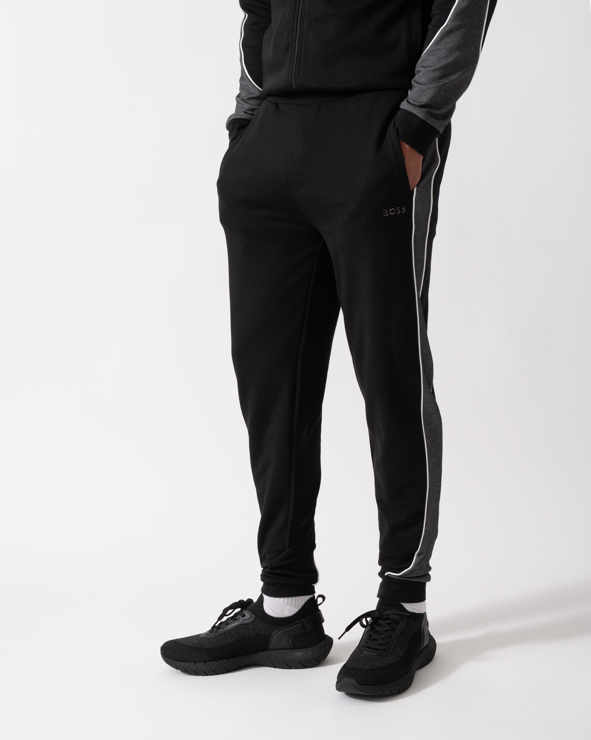 Model wearing a BOSS Orange Mens Loungewear Tracksuit Pants in Black