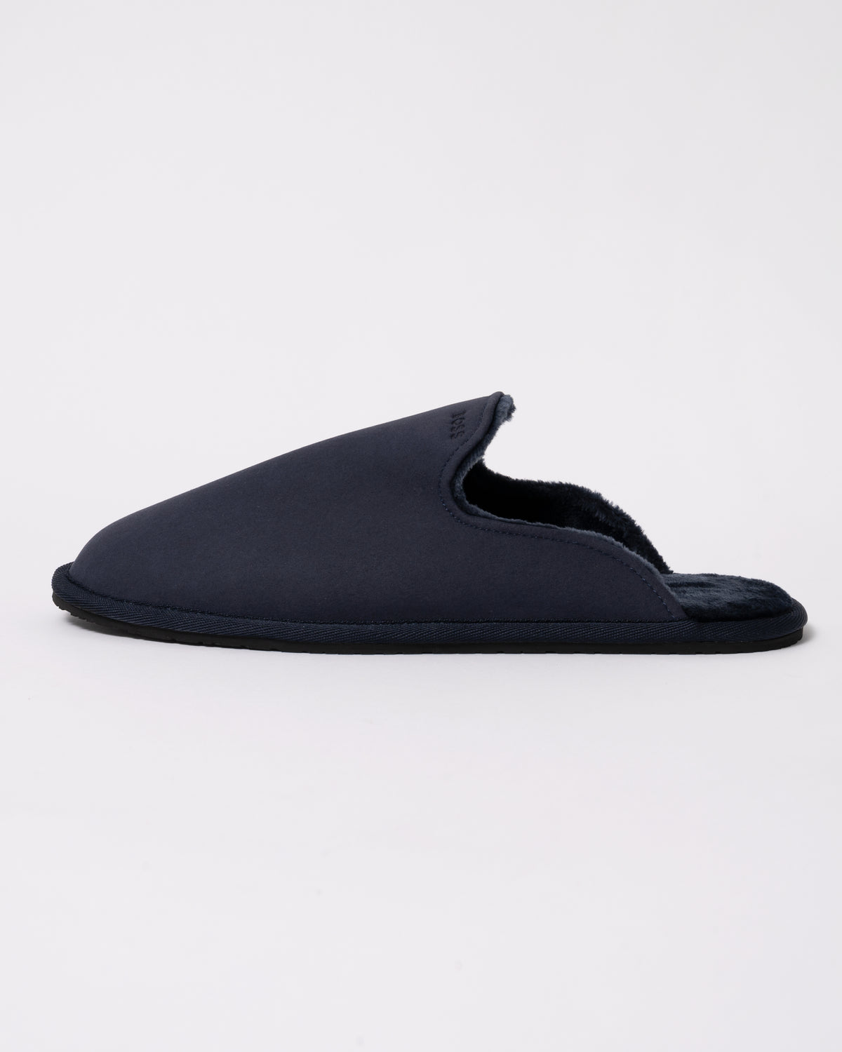 Studio photograph showing side view of BOSS Orange Mens Shearling-lined slip-on slippers with logo detail in Dark Blue 404