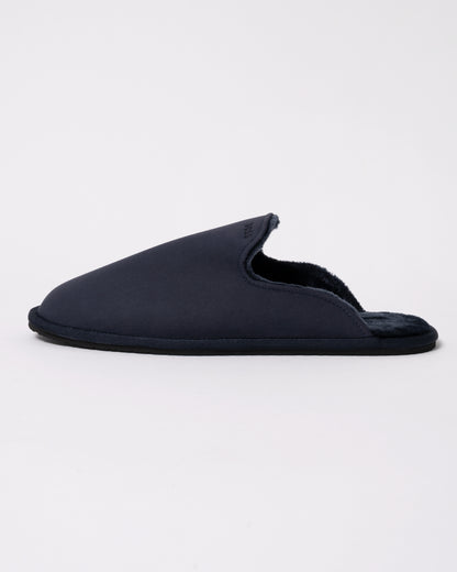 Studio photograph showing side view of BOSS Orange Mens Shearling-lined slip-on slippers with logo detail in Dark Blue 404