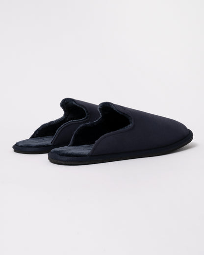 Studio photograph showing back view of BOSS Orange Mens Shearling-lined slip-on slippers with logo detail in Dark Blue 404