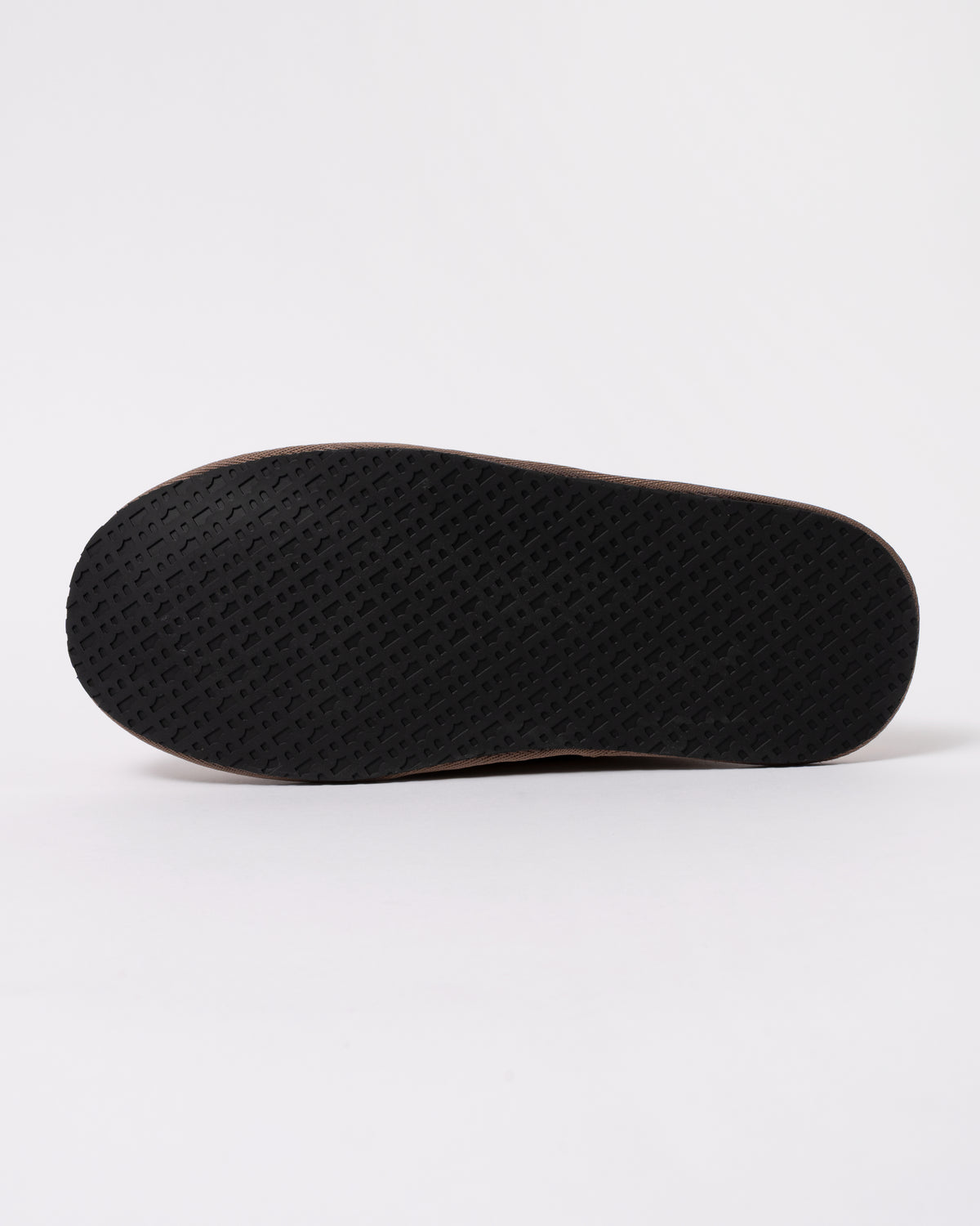 Studio photograph showing sole of BOSS Orange Mens Shearling-lined slip-on slippers with logo detail in Medium Beige 260