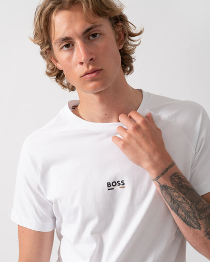 close up model wearing a BOSS Orange Mens Slim Fit Beach T-Shirt in Natural 105