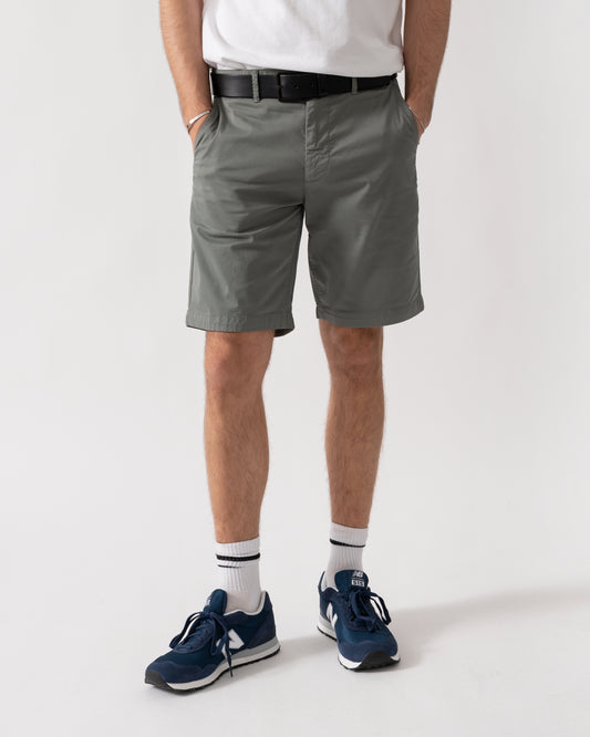 studio shot of a model wearing a pair of BOSS Orange Mens Slim Fit Chino Shorts in Stretch Cotton Twill in Open Grey 076