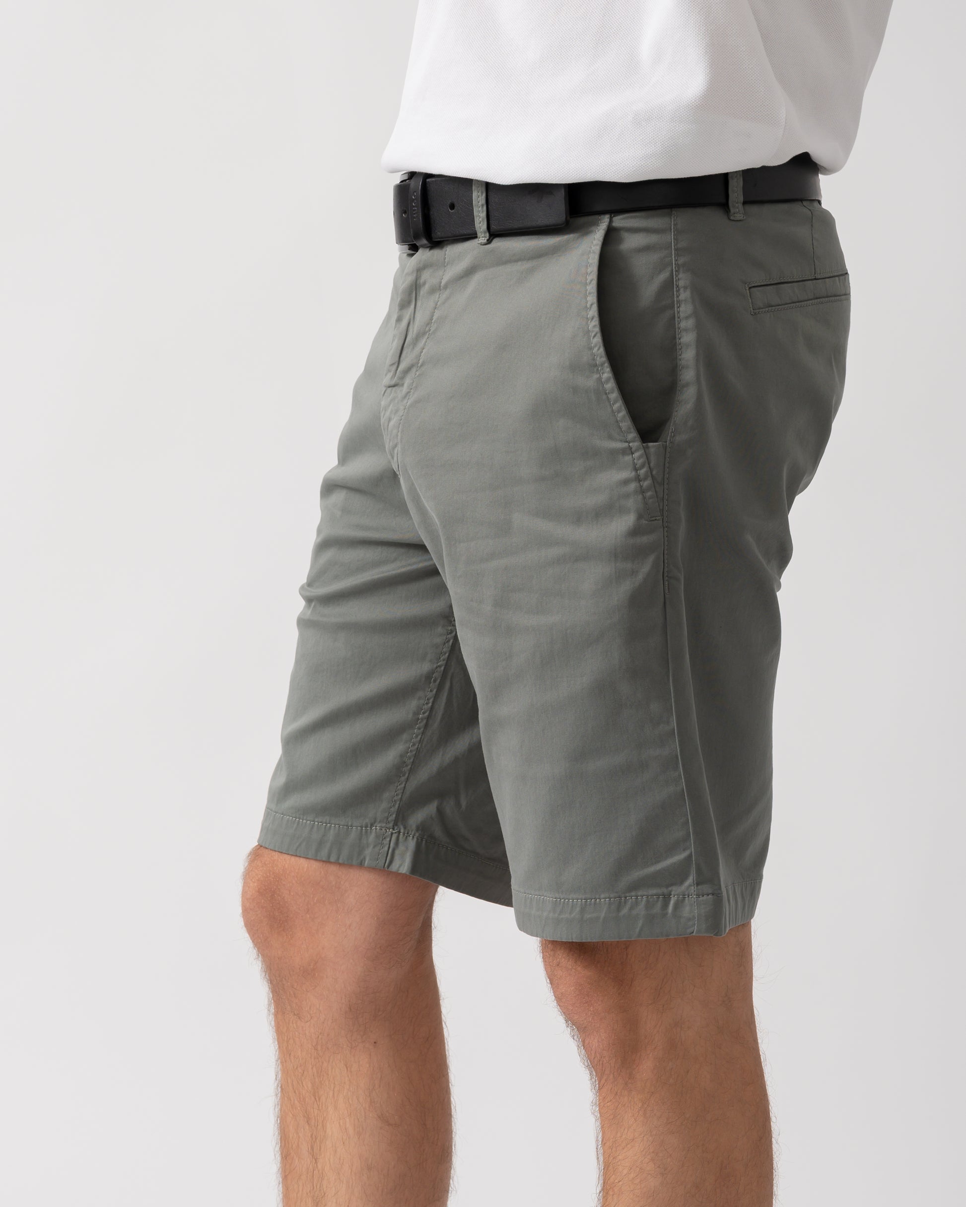 detail shot of a model wearing a pair of BOSS Orange Mens Slim Fit Chino Shorts in Stretch Cotton Twill in Open Grey 076
