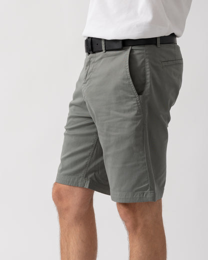 detail shot of a model wearing a pair of BOSS Orange Mens Slim Fit Chino Shorts in Stretch Cotton Twill in Open Grey 076