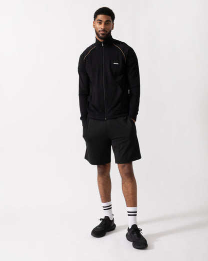 Full length shot of a Model wearing a BOSS Orange Mix&Match Mens Logo-Embroidered Full Zip Loungewear Jacket in black Stretch-Cotton Jersey