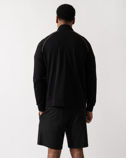 Back shot of a Model wearing a BOSS Orange Mix&Match Mens Logo-Embroidered Full Zip Loungewear Jacket in black Stretch-Cotton Jersey