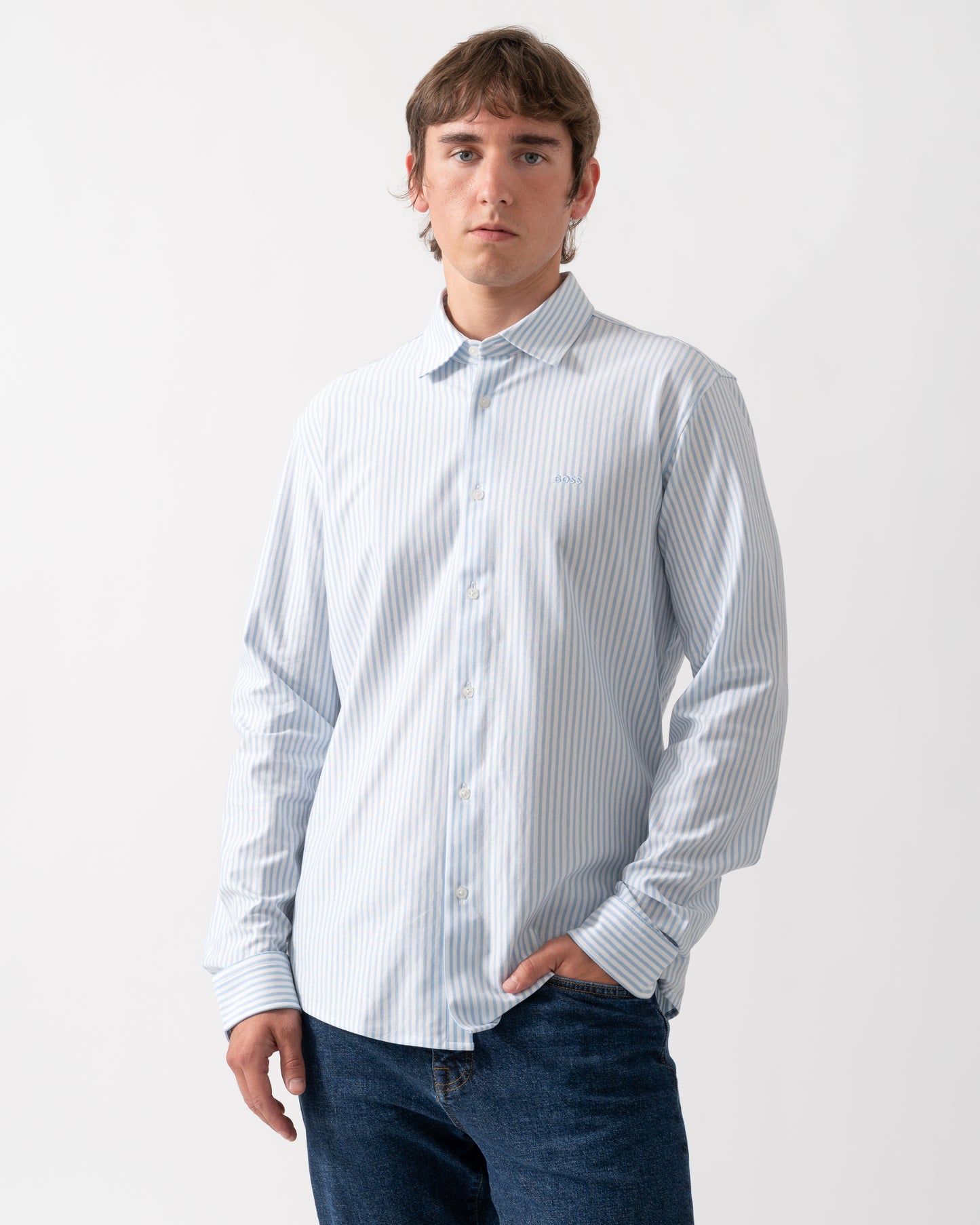 model wearing a BOSS Orange Mysoft Mens Slim-Fit Shirt in Melange Cotton Jersey in Open Blue 461