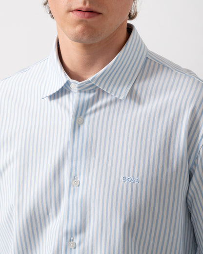 detail of model wearing a BOSS Orange Mysoft Mens Slim-Fit Shirt in Melange Cotton Jersey in Open Blue 461