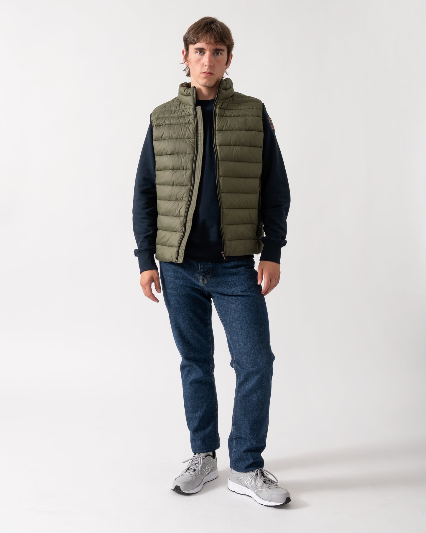 full length shot of a model wearing a BOSS Orange Odeno 2 Mens Gilet in Bright Green 325