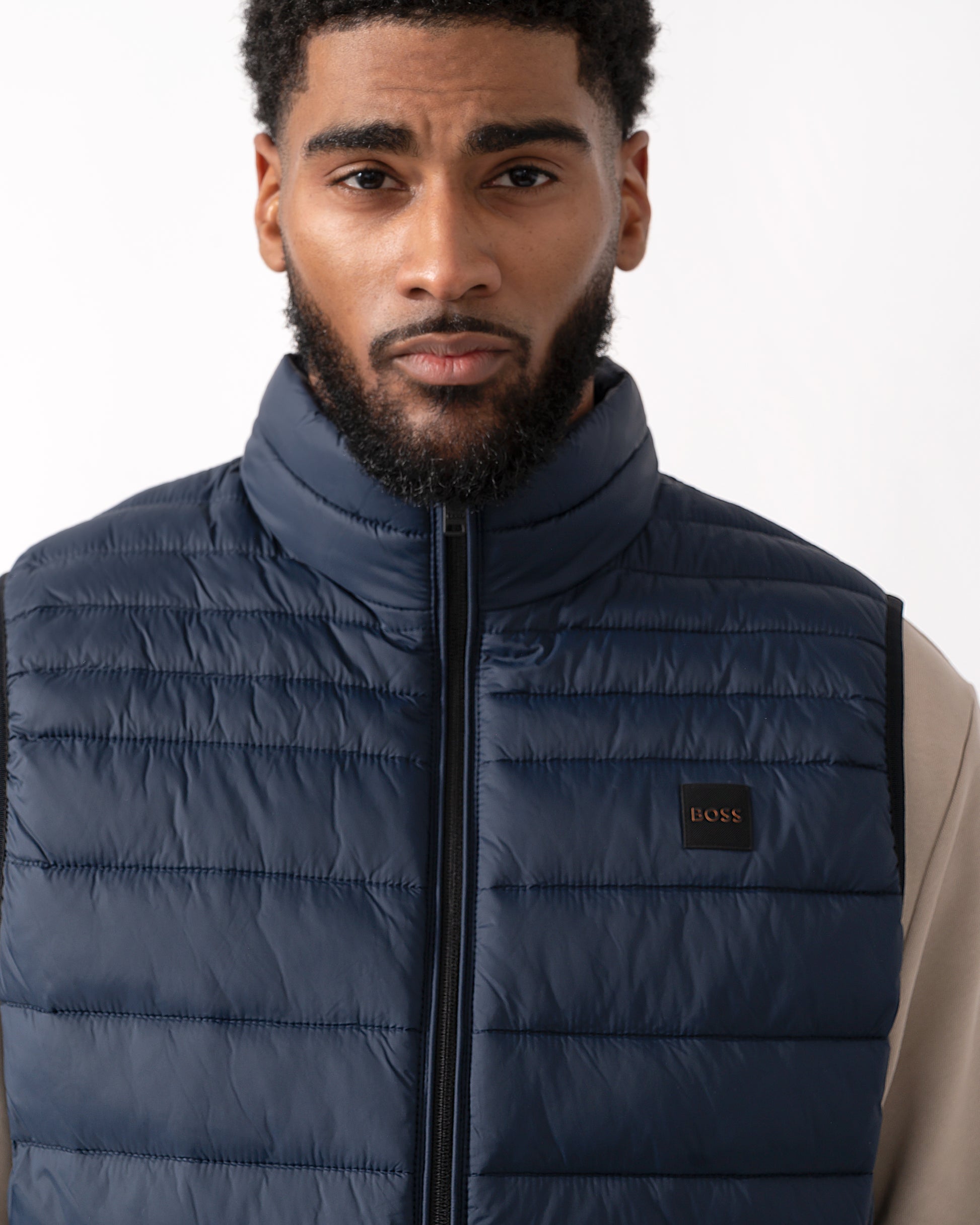 close up of a Model wearing a BOSS Orange Odeno 2 Mens Gilet in Dark Blue