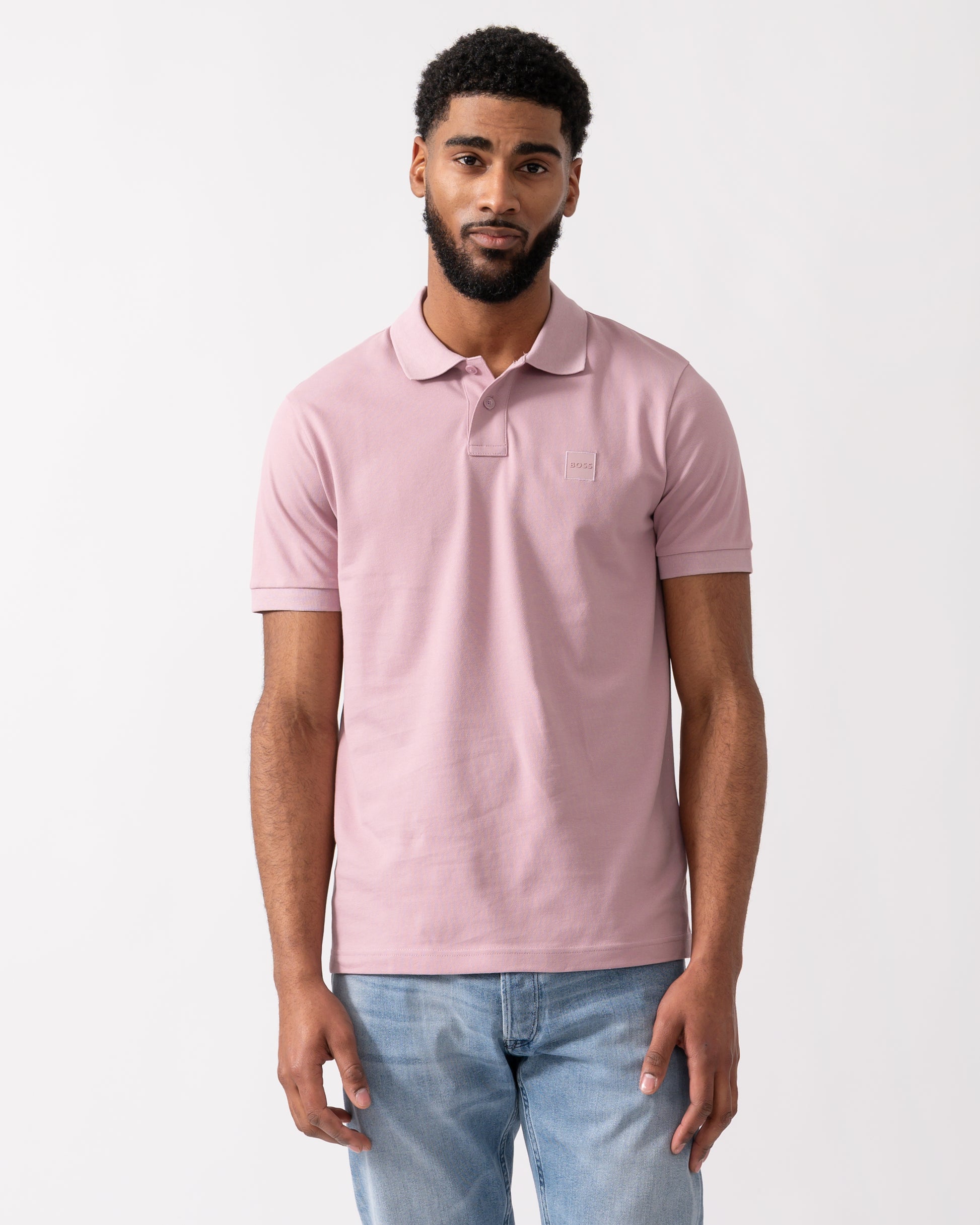 model wearing a BOSS Orange Passenger Mens Stretch-Cotton Slim-Fit Polo Shirt with Logo Patch in Light/Pastel Purple