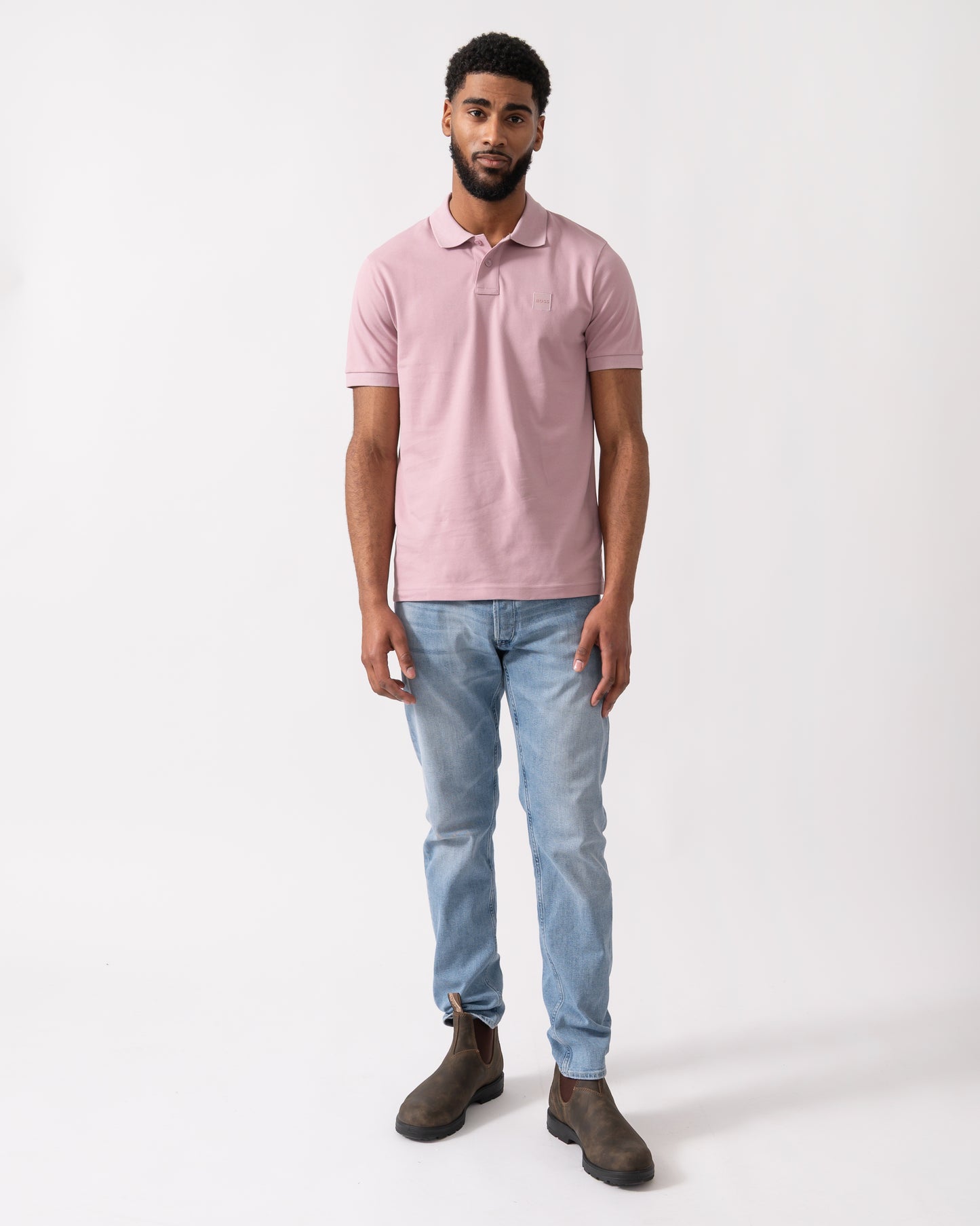 full length shot of a model wearing a BOSS Orange Passenger Mens Stretch-Cotton Slim-Fit Polo Shirt with Logo Patch in Light/Pastel Purple